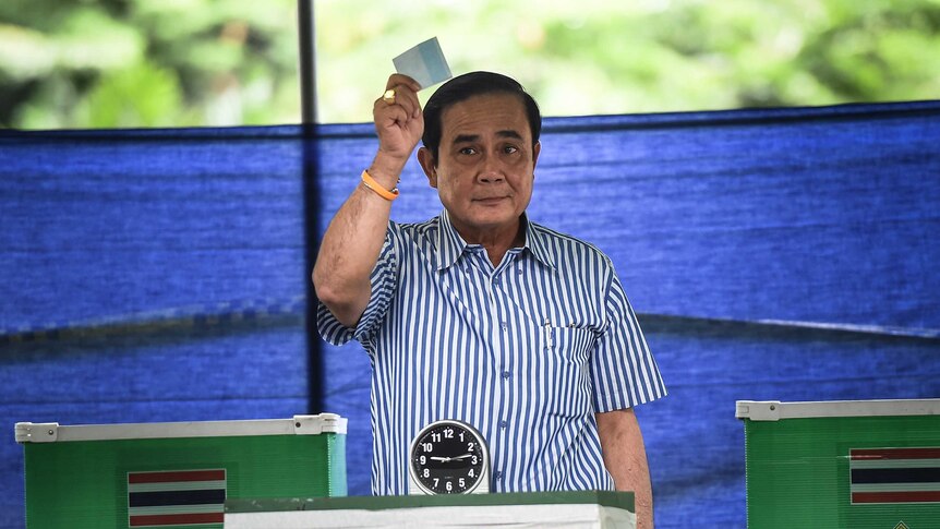 Thai Prime Minister Prayuth Chan-ocha votes in a constitutional referendum.
