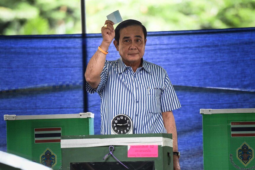 Thai Prime Minister Prayuth Chan-ocha votes in a constitutional referendum.