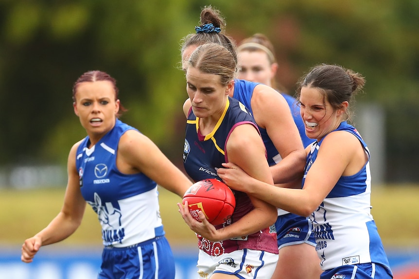 Greta Bodey is tackled by Bella Eddey.