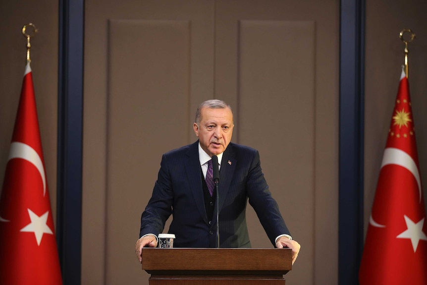 Turkish president Recep Tayyip Erdogan speaks before NATO