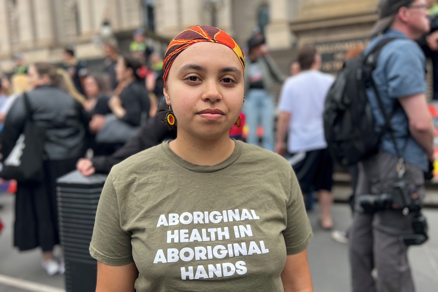 Indigenous woman outside parliament house in Melbourne.