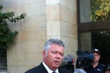 2nd photo of Buswell at press conference speaking publicly after affair