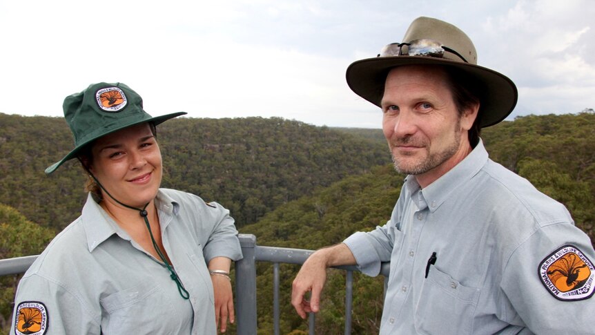 Two National Parks and Wildlife Service employees, David Duffy and Jacinta Rheinberger, stand at O'Hare's lookout.