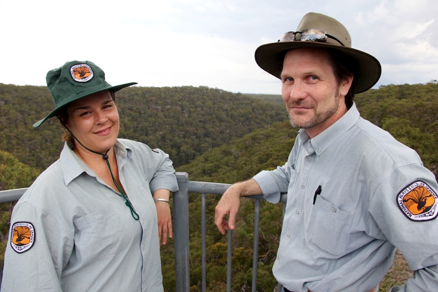 Two National Parks and Wildlife Service employees, David Duffy and Jacinta Rheinberger, stand at O'Hare's lookout.