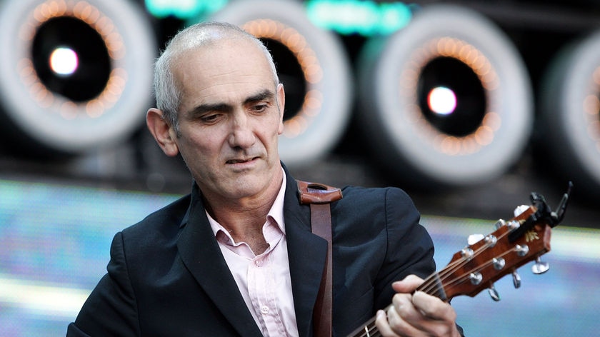 Paul Kelly performs on stage at the Sydney leg of the Live Earth concerts