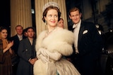 Claire Foy wears a diamond tiara and white fur coat in the show The Crown.
