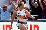 Lauren Arnell celebrates kicking a goal during the 2021 AFLW grand final against the Adelaide Crows