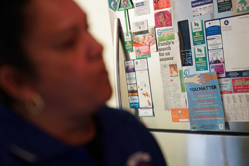 A newspaper clipping of an article about Lewis Buddy Kelly is stuck to the fridge of his family's home.