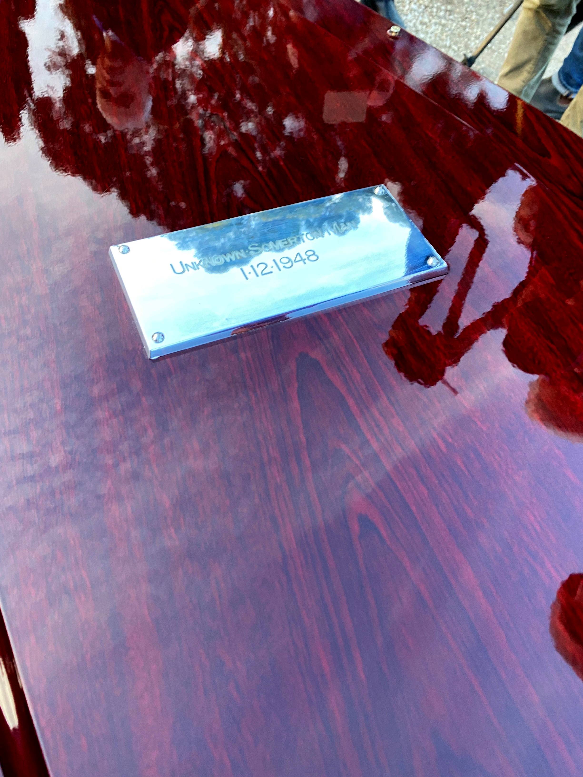 A plaque on a new coffin for the Somerton Man.