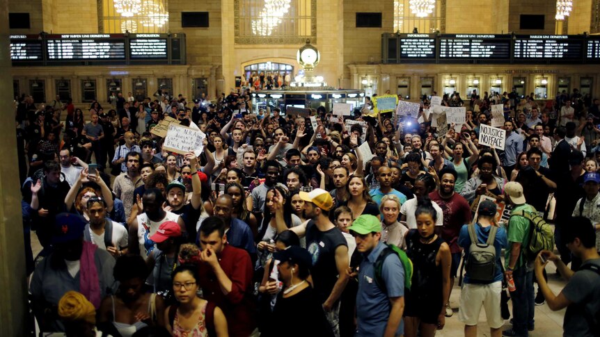 People protest in Grand Central Station