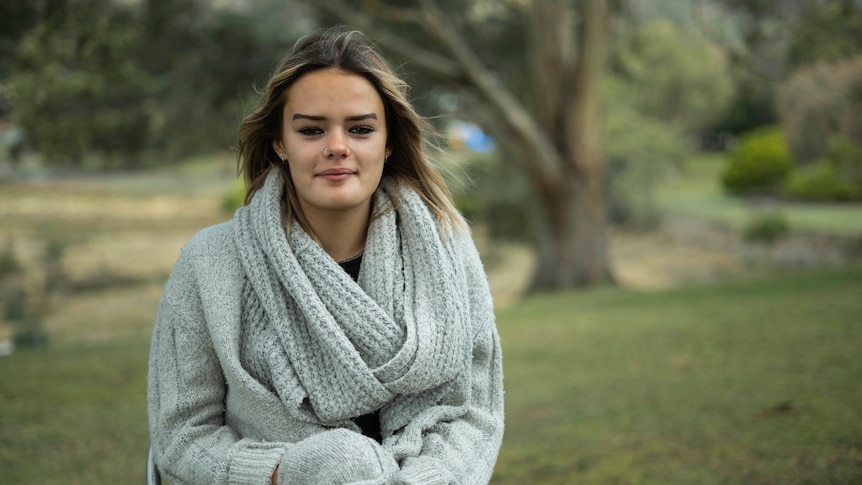 A young woman in a park.