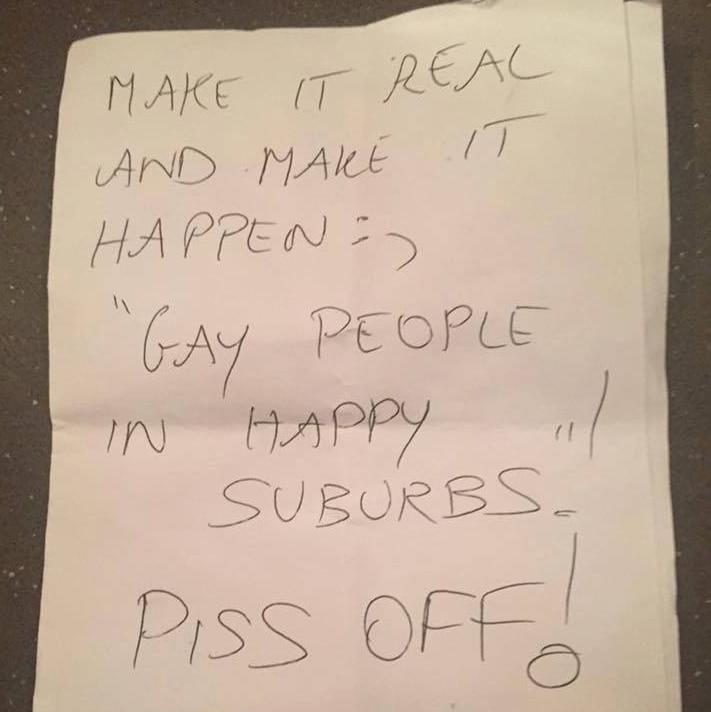 Handwritten note saying: Make it real and make it happen. "Gay people in happy suburbs" Piss off!