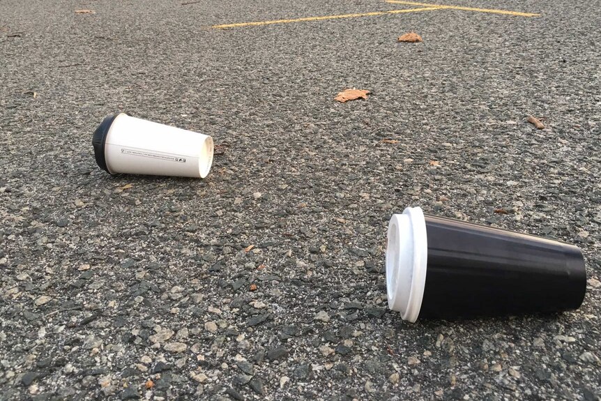 Disposable coffee cups dumped in a carpark