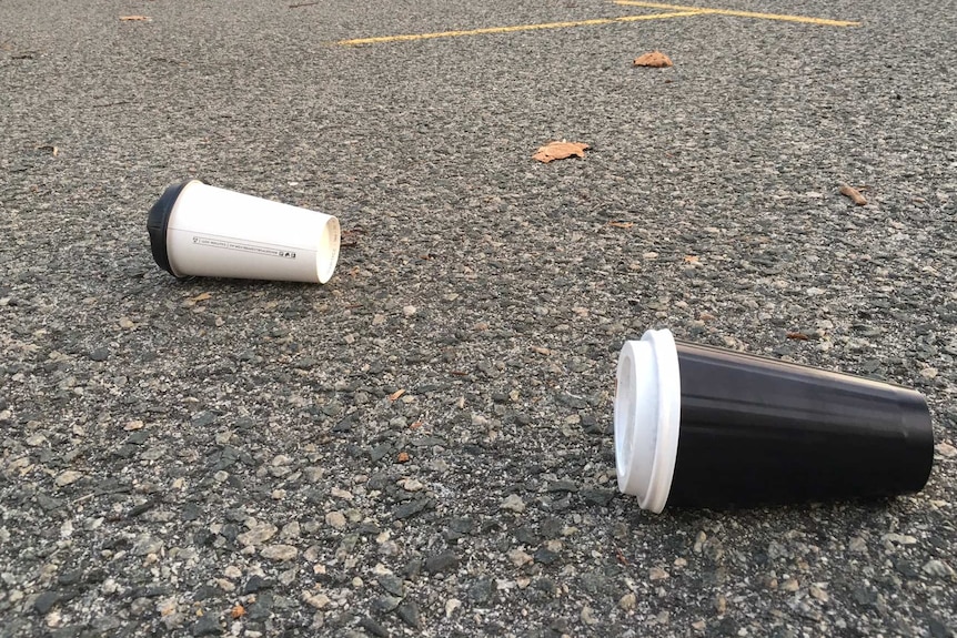 Disposable coffee cups dumped in a carpark