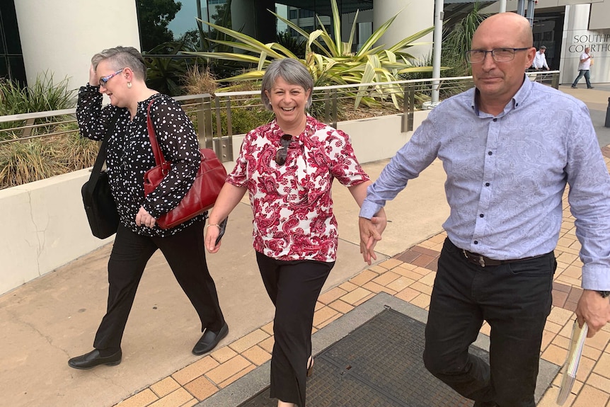 The three defendants representing themselves- Laura Lawson, Donna Baluskas, Miguel Baluskas- leave the courthouse.