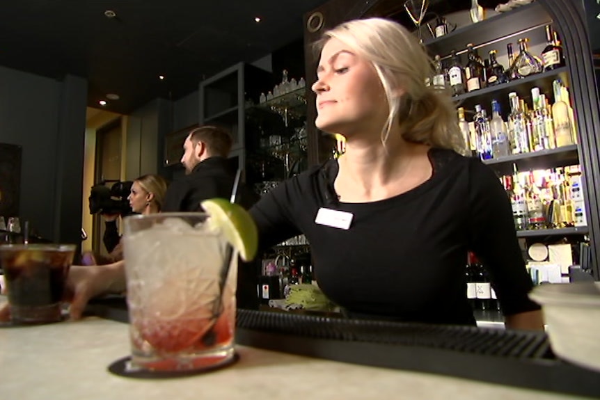 Generic woman serving drinks at bar