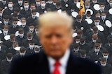US President Trump stands among U.S. Army cadets as he attends the annual Army-Navy collegiate football game