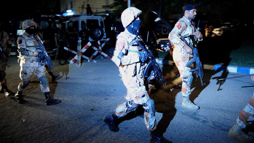 Pakistani security personnel arrive at Jinnah International Airport in Karachi.
