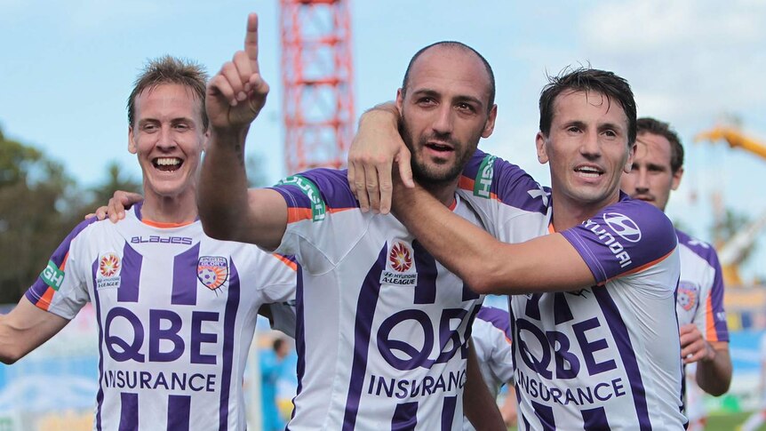 Billy Mehmet (C) celebrates after scoring the winner for Perth against the Melbourne Heart.
