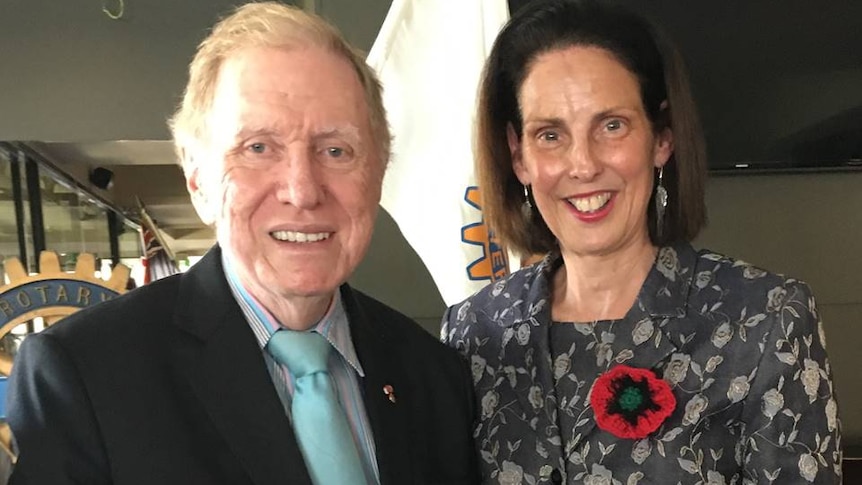 A man and a woman posing for a photograph together.