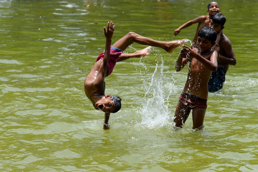 Indian children cool down during heatwave