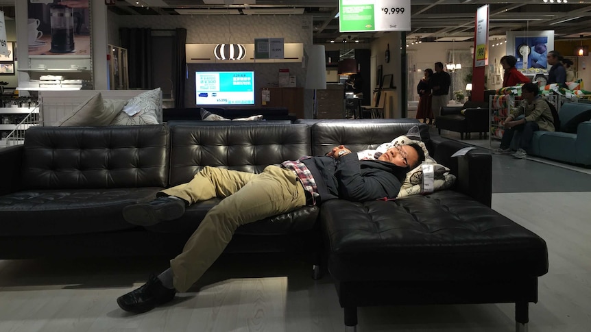 Ikea customer napping in Beijing