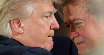 Steve Bannon leans in to speak to Donald Trump.