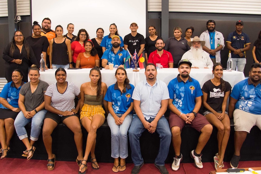 The Empowered Youth Leader delegates stand together for a group picture.