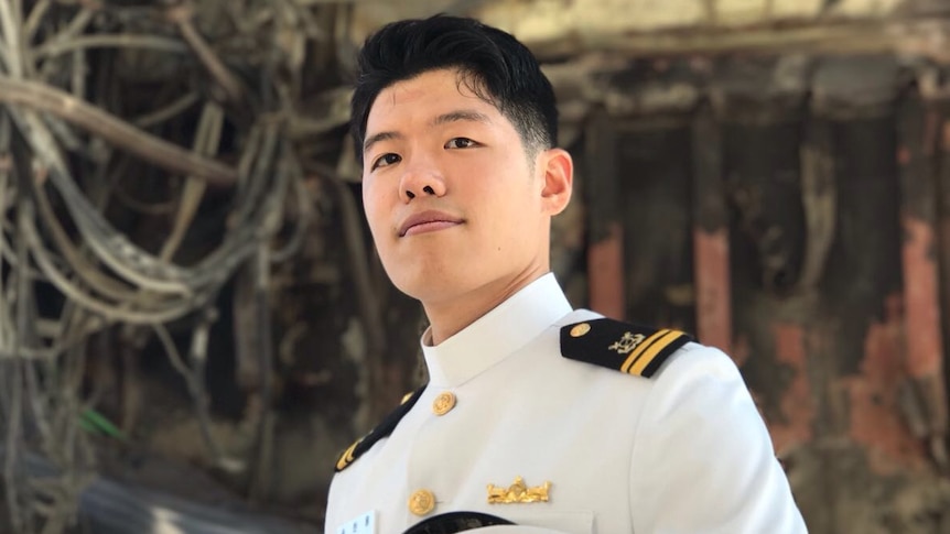 Han Woong Song poses with his hat at the military base