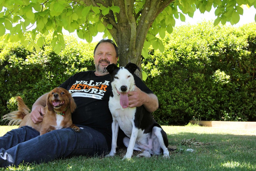 Brad Coates with dogs Angus and Bella