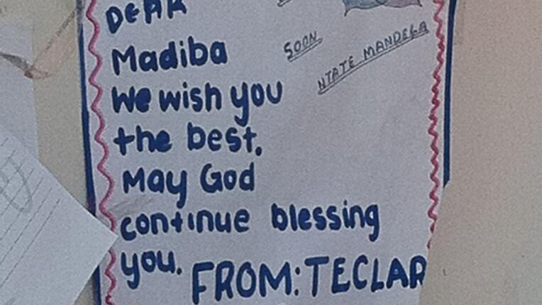 Messages of support for Nelson Mandela have been posted outside the hospital in Pretoria.