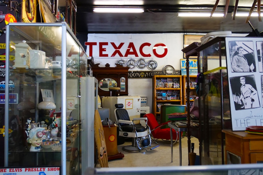 A sign in an oddities shop that reads "Texaco".