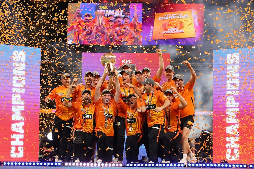A group of cricketers celebrate winning a tournament 