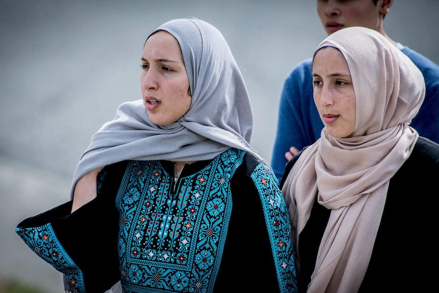 Women in Islamic garb.