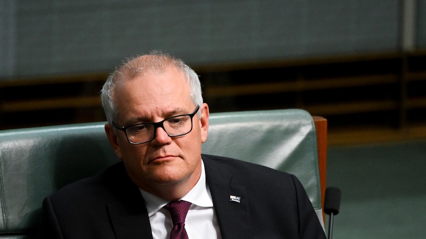 Scott Morrison slumps in his chair during Question Time