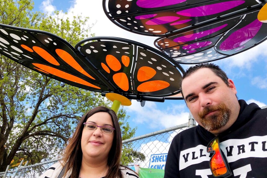 Angie and James Whitting stand under the butterflies at the new Eaglehawk Playspace in Bendigo.