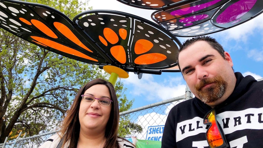 Angie and James Whitting stand under the butterflies at the new Eaglehawk Playspace in Bendigo.