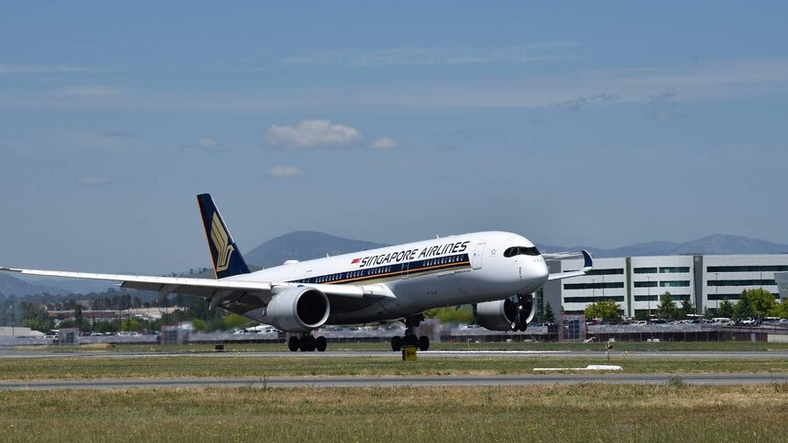 A Singapore Airlines flight touches down in Canberra.