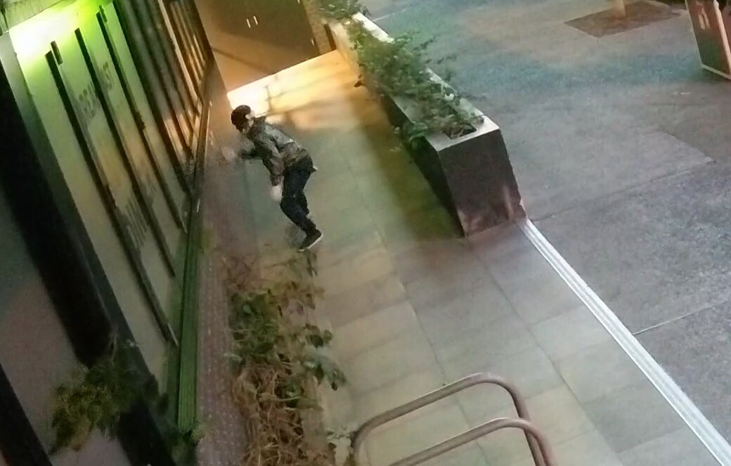 A Woolworths Metro in the Brisbane suburb of Teneriffe is spray painted with profanities.