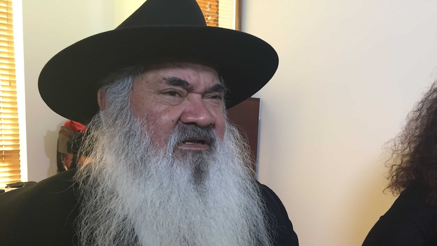 Aboriginal leader and Labor Senator Pat Dodson wearing a hat while speaking about the Government's work-for-the-dole program