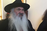 Aboriginal leader and Labor Senator Pat Dodson wearing a hat while speaking about the Government's work-for-the-dole program