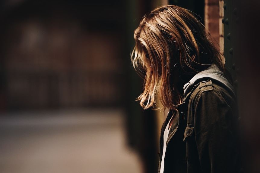 Unidentified female with hair covering face.