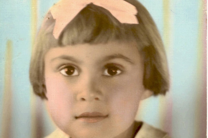 Vintage photograph of a young girl, approximately four years old