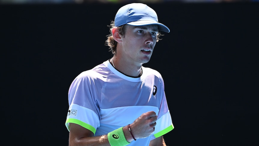 An Australian male tennis player pumps his fist during an Australian Open match.