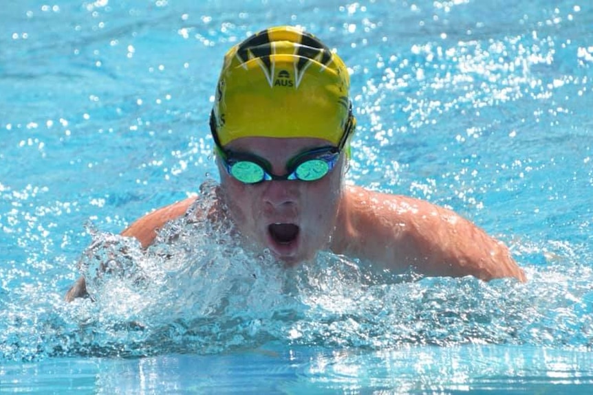 A swimmer with down syndrome competes in Brisbane.