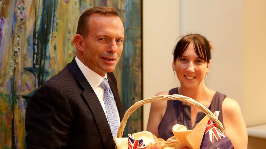 Onions Australia chief executive Lechelle Earl meets Prime Minister Tony Abbott in his Canberra office, where he bit into a second raw onion.