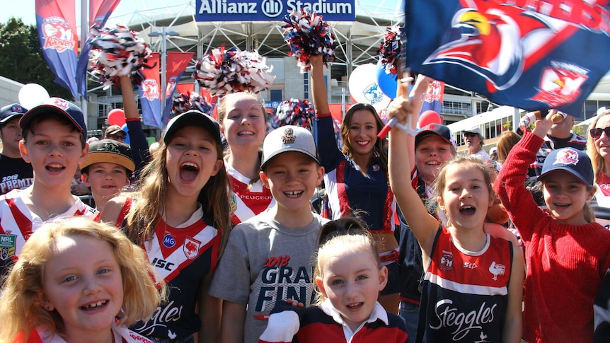 Younger Roosters fans celebrating