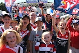 Younger Roosters fans celebrating