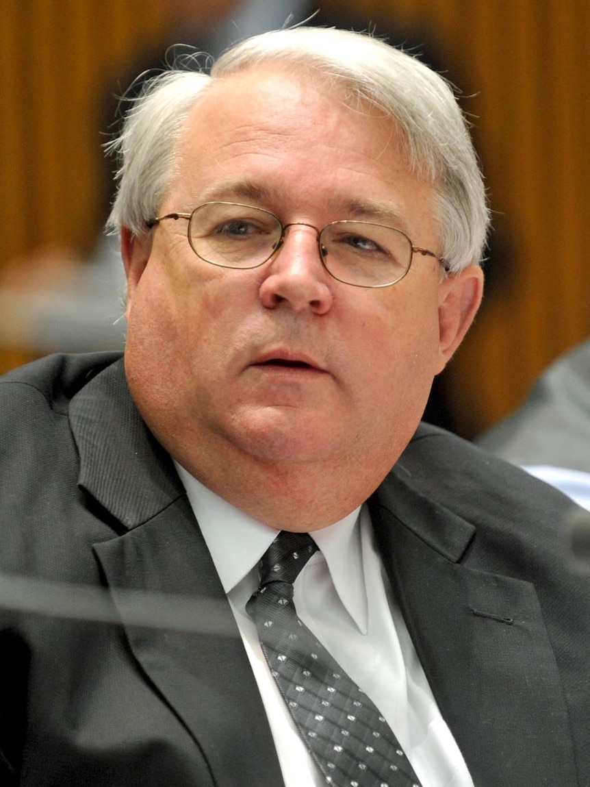 Immigration Department secretary Andrew Metcalfe listens during a Senate hearing in Canberra on October 17, 2011.