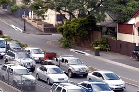 Traffic passes close by residential houses in the inner-city Brisbane suburb of Paddington (ABC News: Giulio Saggin)